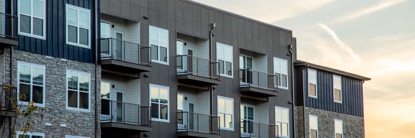 Exterior view of mid-rise apartment building with balconies