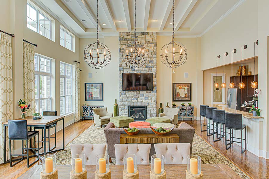 All apartments offer amenities but some also include utilities in the rent as a perk. The fireplace and bar counter in the common room at Ivy Flats Apartments.